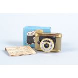 A Grey-Gold Petie Subminiature Camera, supplied by Walter Kunik of Frankfurt, VG, shutter working,