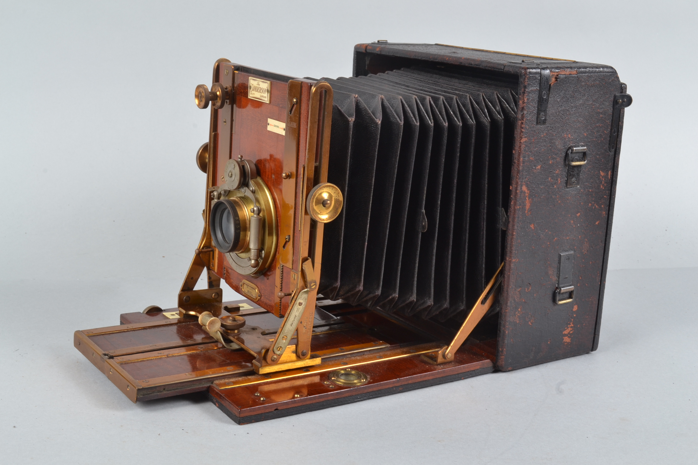 A Sanderson De Luxe Hand and Stand Camera, 6½ x 4¾in, made by Houghtons Ltd, serial no 20035,