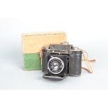 A Certo Dollina II Rangefinder Folding Camera, serial no. 18580, body F, bubbling to leatherette,