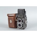 A Rolleiflex 3.5 MX-EVS K4B TLR Camera, serial no 1 476 496, button in aperture wheel disengages