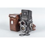 A Rolleiflex 2.8F K7F TLR Camera, serial no 2 407 689, body G, slight paint losses, spots to