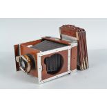 A Shew Xit Folding Plate Camera, circa 1900, quarter plate, mahogany and aluminium construction,