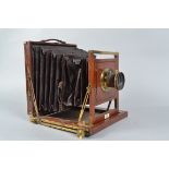 A Thornton Pickard Imperial Whole Plate Mahogany Field Camera, nameplate J. HANCOCK OPTICIAN 61 CITY