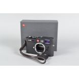 A Leica M8 Black-Chrome Digital Body, serial no 3 106 397, 2006, body VG, small hole in accessory