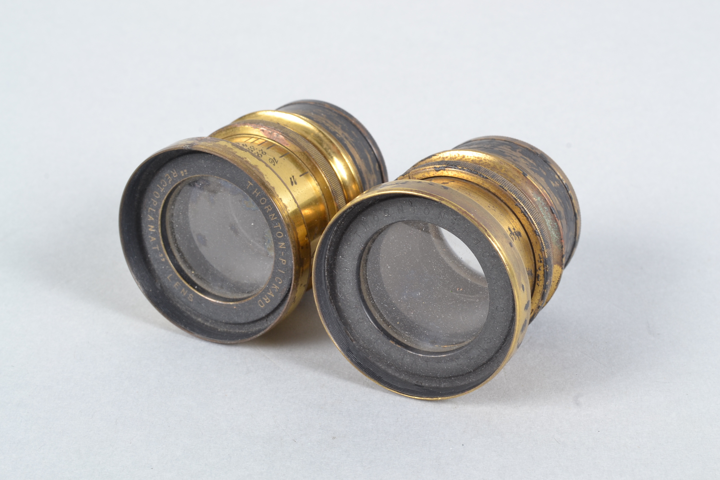 A Pair of Thornton-Pickard Rectoplanat Brass Lenses, each f/8, 9in approx focal length, barrels P-F,