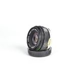 An Olympus OM-System Zuiko Auto-S 50mm f/1.8 Lens, serial no 5 147 708, barrel VG-E, elements VG-