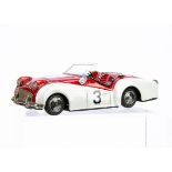 A Bandai (Japan) Tinplate Friction Drive Triumph TR3 Sports Car, metallic red/white competition