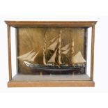 Model Galleon in wood and glass display case, 3-masted British Galleon, basic detail with three