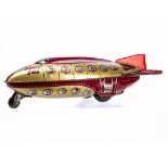 A Wells Brimtoy Tinplate Friction Drive Space Ship, c 1952, with siren motor, gold/red body, red