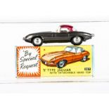 A Corgi Toys 307 E-Type Jaguar, metallic grey body, brown interior, spun hubs, detachable hardtop,