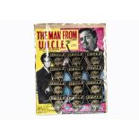 Lone Star The Man From U N C L E Badges, complete set of twelve plastic No 2 badges on original