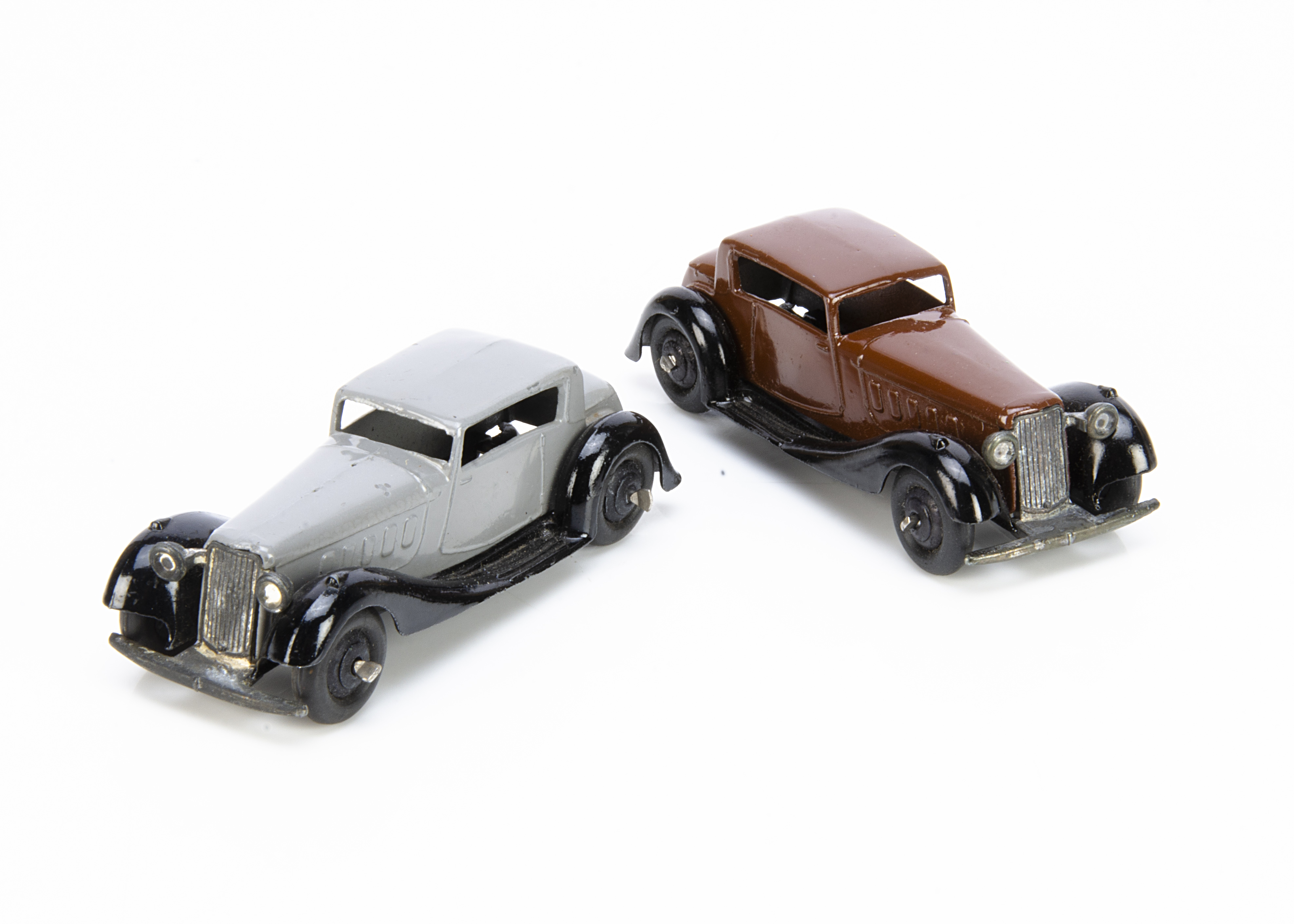 Dinky Toys 36c Humber Vogue, two examples, first dark brown body, black moulded chassis and ridged