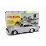 A Gilbert Unofficial James Bond 007 Secret Agent's Aston Martin, 1960s, silver tinplate body, chrome