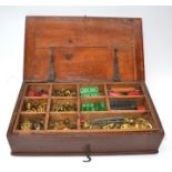 Collection of red and green Meccano in wooden box with tray, including girders, plates, various
