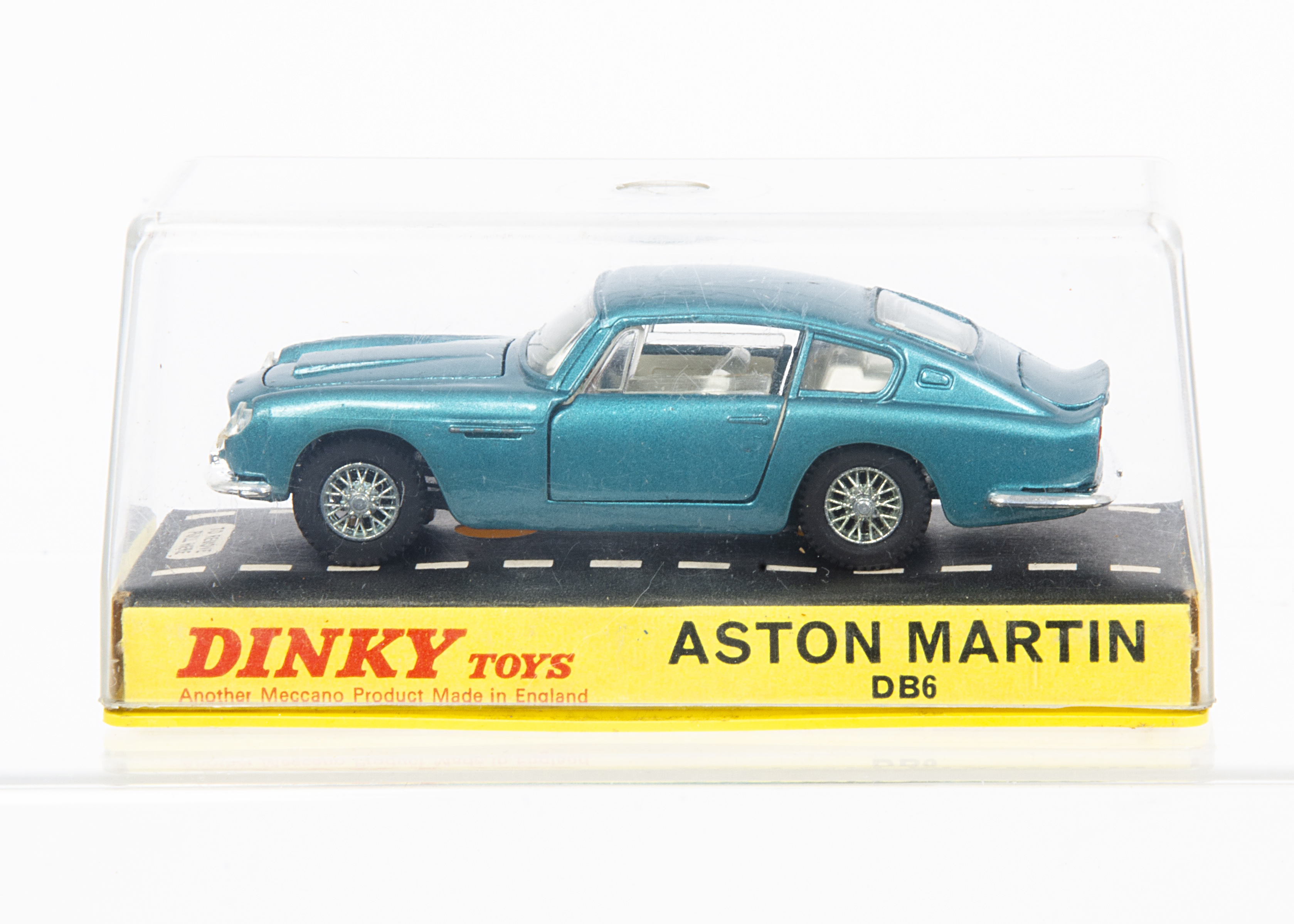 A Dinky Toys 153 Aston Martin DB6, metallic turquoise body, white interior, cast spoked wheels, in