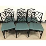 A set of six modern faux bamboo black painted dining chairs, with rattan seats and green upholstered
