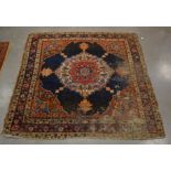 A Middle Eastern rug of near square proportions, with central octofoil shape, surrounded by a