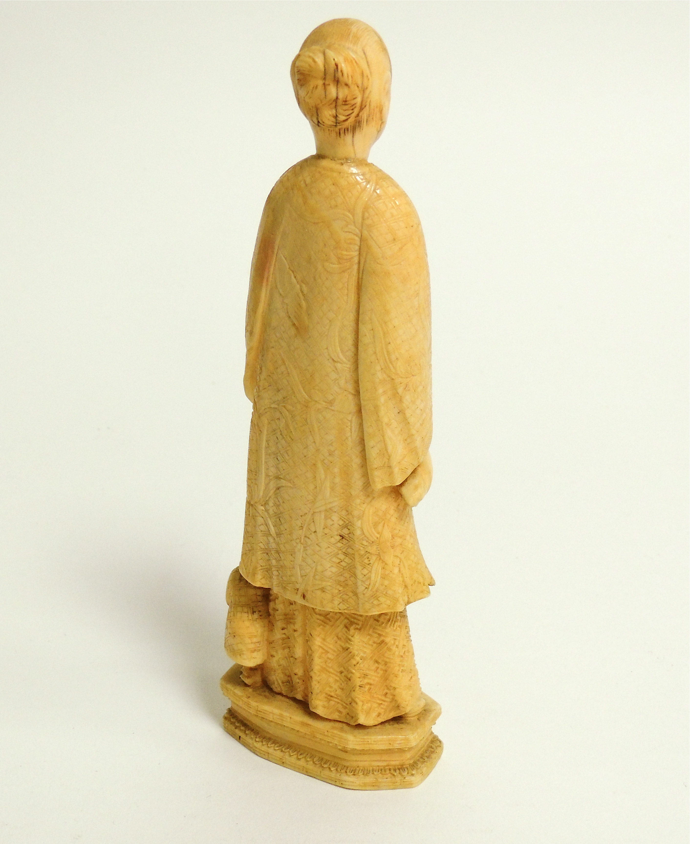 A Chinese marine ivory carving of a lady with an umbrella, probably walrus, with a young child and - Image 2 of 4