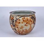 A pair of 20th Century Chinese fish bowls, with internal goldfish, the exterior decoration in the