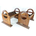 A pair of late 19th or early 20th Century mahogany book troughs, the sides with open split