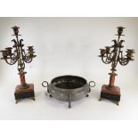 A pair of 19th Century four branch brass candelabra, raised on marble block, plinth and four feet,