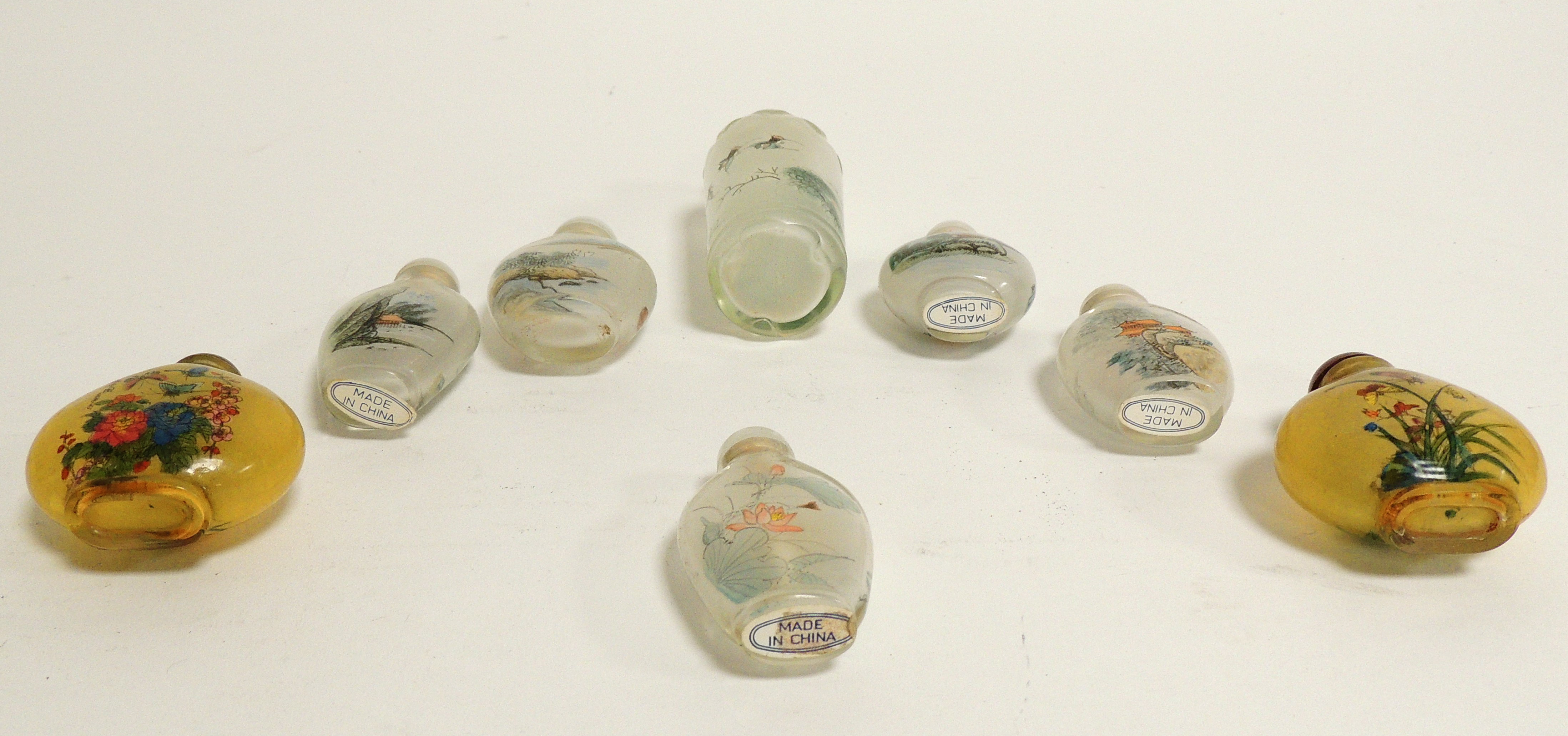 A small group of Chinese reverse glass painted snuff bottles, including a near pair decorated with - Image 2 of 3