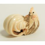 A Japanese Meiji period (1868-1912) or early Taisho (1912 - 1926) ivory netsuke in the form of a