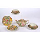 A Chinese Guangxu (1875-1908) part porcelain part tea set of millefiori design, with polychrome