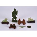 A small group of Chinese nephrite and bowenite figures, to include a figure of an Immortal holding a