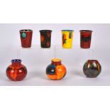 Seven pieces of Poole Pottery, to include four beaker shaped vases, height 9.5cm, two bulbous