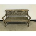 A modern garden bench, from Robert Dyas, probably teak, 138cm wide