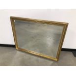 A modern gilt wall mirror, external measurements 112cm x 88cm