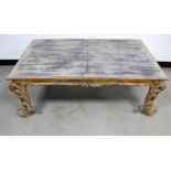 A contemporary rectangular coffee table in the Rococo style, with a distressed gilded finish, 80cm