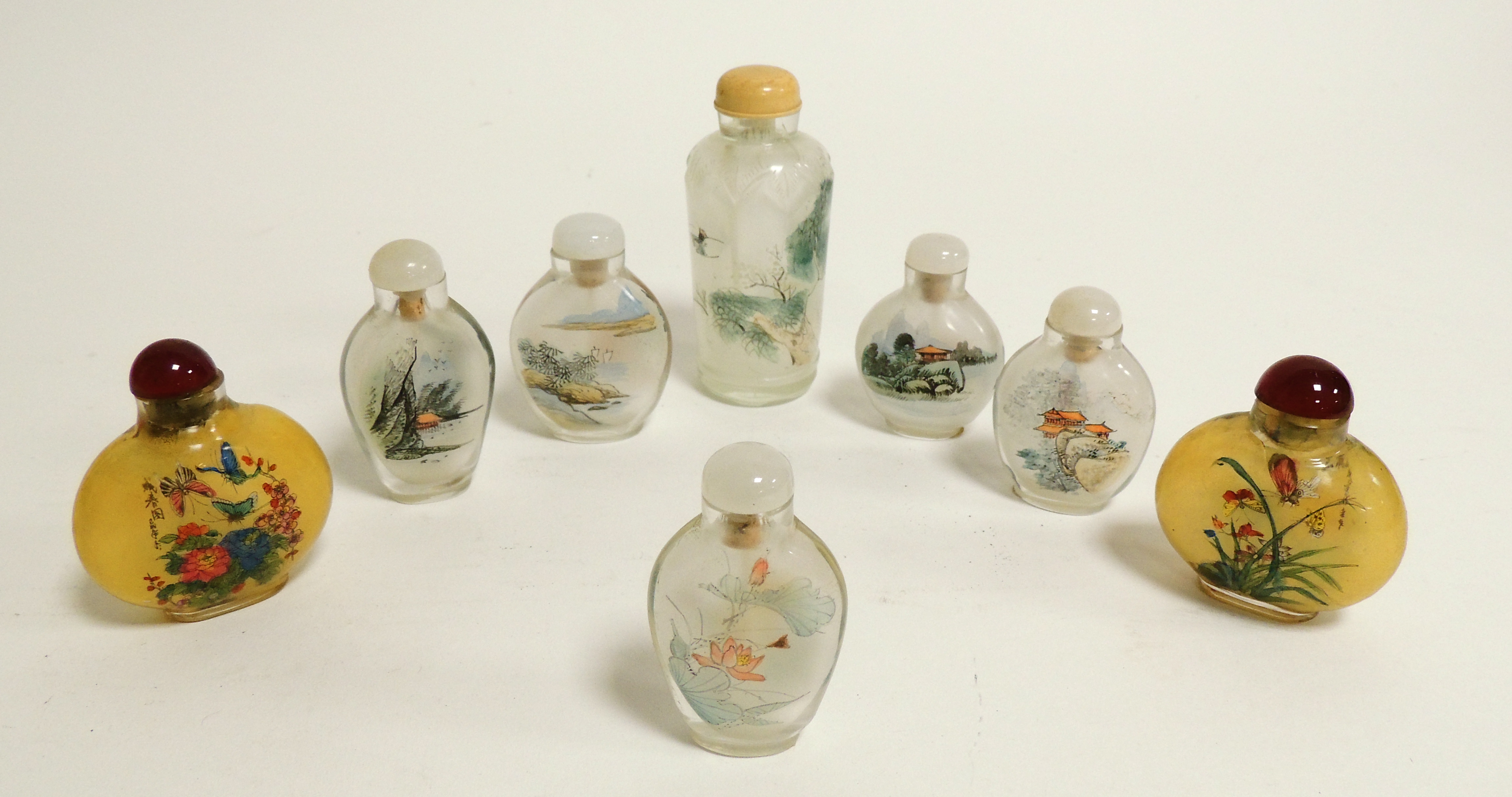 A small group of Chinese reverse glass painted snuff bottles, including a near pair decorated with - Image 3 of 3