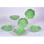 A set of six contemporary green glazed porcelain bowls, as lily leaves with moulded frog design,