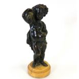 A 19th Century bronze study of a young boy gathering the harvest, raised on a circular plinth,