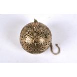 An Islamic white metal incense burner, of pierced spherical foliate form, length on chain 12cm