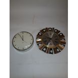 1970s Sunburst Wall Clock and Another, a Sunburst wall clock by Climax battery operated with