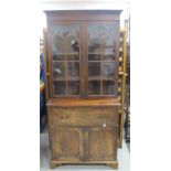 A 19th Century mahogany secretaire bookcase, moulded cornice, over gothic glazed doors, the interior
