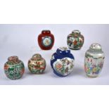 A powder blue Chinese ginger jar with fan and foliate shaped cartouches of flora and fauna, with