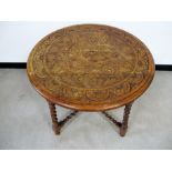 A James Schoolbred early 20th Century oak occasional table, circular top and shape frieze carved