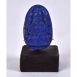 An oval shaped Lapis Lazuli block mounted on contemporary stand, in the form of an Eastern deity,