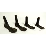Four cast iron shoe lasts, in graduated sizes, possibly from a cobblers, the largest 23cm (4)