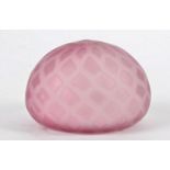 A pink Burmese glass paperweight, approximately 9cm x 6.5cm