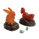 A Chinese Jadeite carving of a rabbit, height 6cm, together with a jadeite Pekinese dog playing with