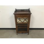 A late Victorian mahogany and inlaid music cabinet, with mirrored and glazed door, 56cm high,