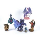 Three boxes of novelty resin dragon figures, to include 'Land of the Dragons Medium Amethyst