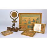 A small group of Asian works including a wooden carving of figures in a chilong shaped boat,