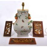 A contemporary Asian lamp base, decorated with butterflies and foliage upon a white ground, the