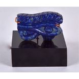 A Lapis Lazuli block mounted on contemporary stand, in the form of an archaic Eastern motif,